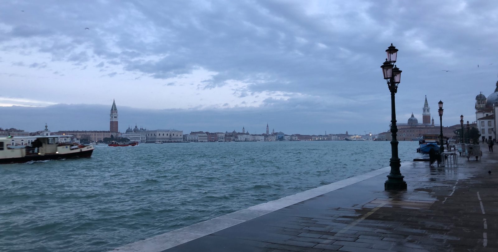 Venice waterfront at dusk with lampposts