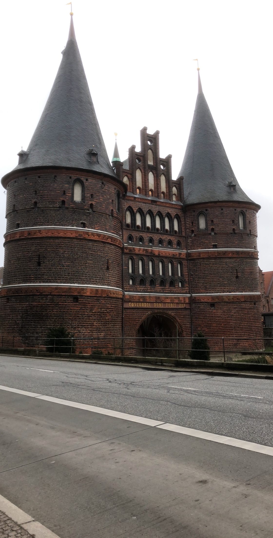 Medieval Twin-Towered Brick Gate on Street