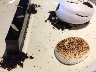 Elegant plated chocolate dessert trio on table