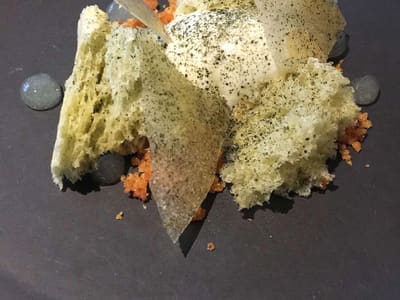 Modern plated dessert on dark dish