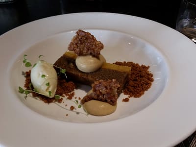 Plated gourmet dessert on white charger
