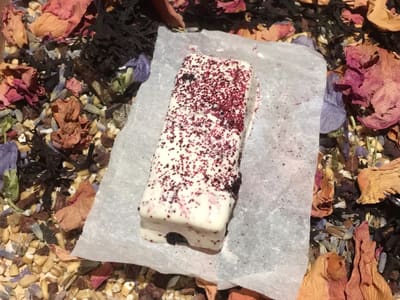 White chocolate bar on floral bed