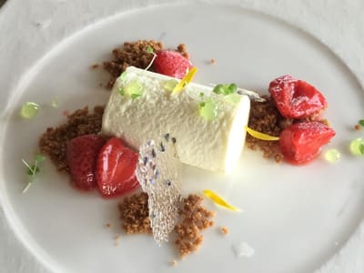 Plated creamy dessert with strawberries