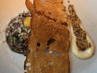 Steak tartare with crispy toast and mustard