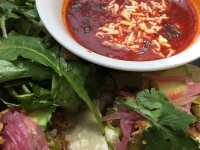 Tacos with red salsa and greens