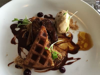 Plated waffles with caramelized banana and mousse