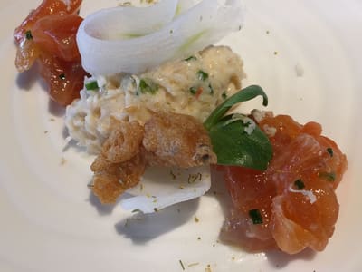 Plated seafood tartare with crisp garnish