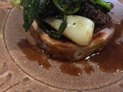 Plated braised meat with vegetables