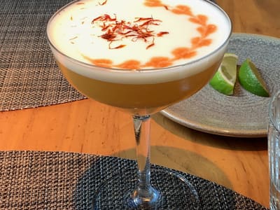Saffron Topped Cocktail on Wooden Table