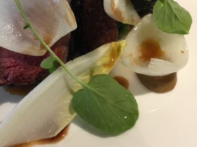 Gourmet medium rare steak with greens