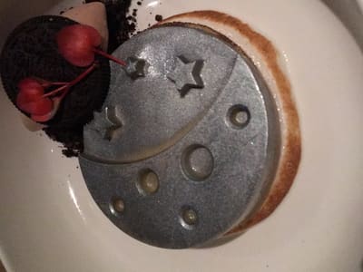 Silver moon dessert on white plate