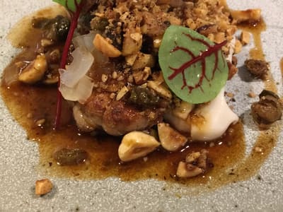 Gourmet plated dish in restaurant setting
