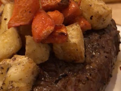 Steak with roasted vegetables and fries