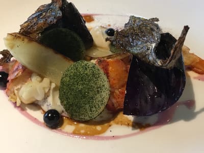 Plated seafood entree at fine dining