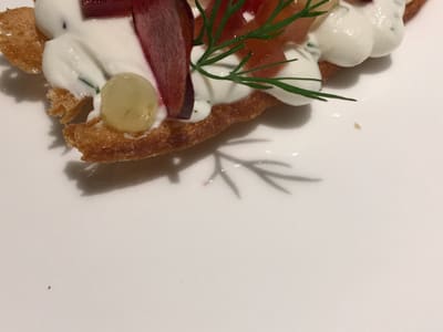 Gourmet canapé with cream and garnishes
