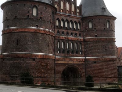 Medieval Twin-Towered Brick Gate on Street